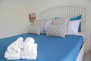 A bed or beds in a room at Casa Vacanze Terramare, 550 mt from the beach, close to Ortigia historic center