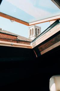 a view of a building from the roof of a car at My Loft in Ferrara