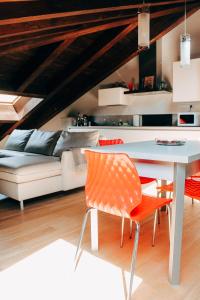 a living room with a table and a couch at My Loft in Ferrara