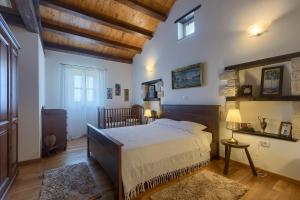 Postel nebo postele na pokoji v ubytování Villa Barbarella