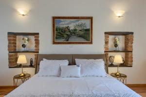 Postel nebo postele na pokoji v ubytování Villa Barbarella