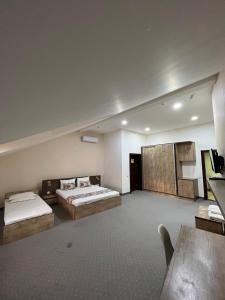 Katil atau katil-katil dalam bilik di Mahmud Hotel