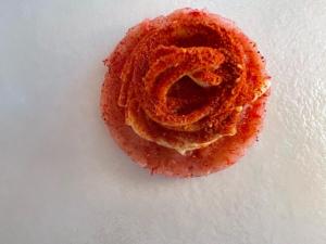 a donut sitting on top of a white plate at Locanda Garzelli in Quercianella