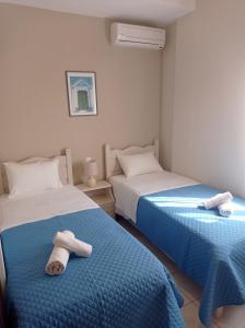 En eller flere senge i et værelse på Domina Villas