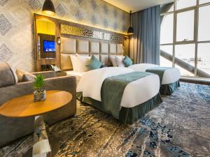 Voodi või voodid majutusasutuse White Diamond Hotel - Al Nuzha toas