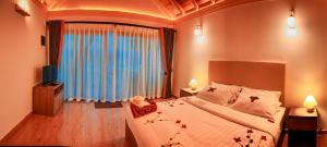 سرير أو أسرّة في غرفة في Sabba Beach Suite , Fodhdhoo - Maldives