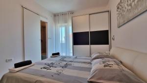 Posteľ alebo postele v izbe v ubytovaní Apartment Milana