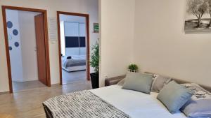 Posteľ alebo postele v izbe v ubytovaní Apartment Milana