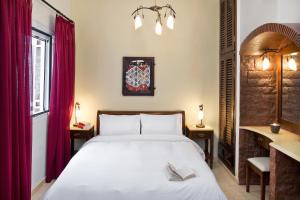 Ein Bett oder Betten in einem Zimmer der Unterkunft Galatia Villas