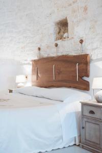 Łóżko lub łóżka w pokoju w obiekcie I trulli di Dioniso - Incipit