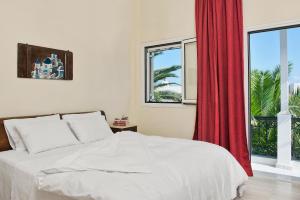 Ein Bett oder Betten in einem Zimmer der Unterkunft Galatia Villas