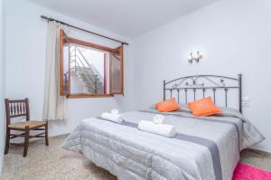 Ένα ή περισσότερα κρεβάτια σε δωμάτιο στο Can Pons