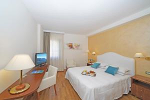 Letto o letti in una camera di Hotel Vigna