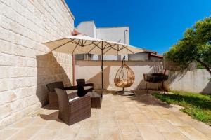 A patio or other outdoor area at Villa Pussacra by BarbarHouse