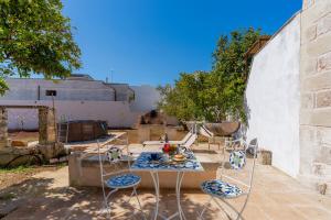 A patio or other outdoor area at Villa Pussacra by BarbarHouse
