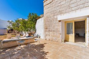 A patio or other outdoor area at Villa Pussacra by BarbarHouse