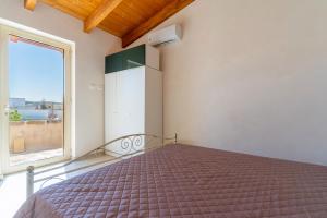 A bed or beds in a room at Villa Pussacra by BarbarHouse