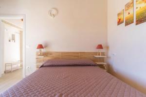A bed or beds in a room at Villa Pussacra by BarbarHouse