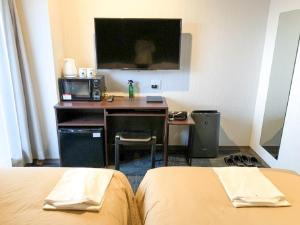 Voodi või voodid majutusasutuse HOTEL LiVEMAX Kyoto Nijojonishi toas