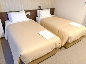 Voodi või voodid majutusasutuse HOTEL LiVEMAX Kyoto Nijojonishi toas