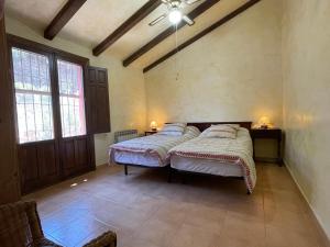 A bed or beds in a room at Casa Ramoncico. Finca el Campillo