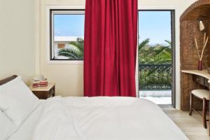 Ein Bett oder Betten in einem Zimmer der Unterkunft Galatia Villas