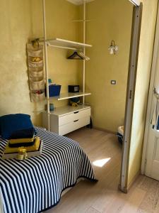 Postel nebo postele na pokoji v ubytování CinqueTerreBlu IrisBlu