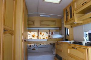 an interior view of a kitchen in an rv at Sunny House Caravans in Sozopol