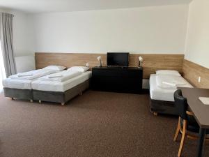 Postel nebo postele na pokoji v ubytování Motel R10