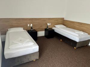 Postel nebo postele na pokoji v ubytování Motel R10