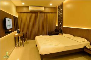 Letto o letti in una camera di Hotel Fortune