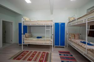 A bed or beds in a room at XALİLA HOSTEL & CAFE LADİES ROOM