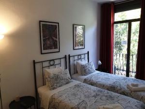 Postel nebo postele na pokoji v ubytování Hostal Absolut Stay