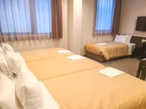 Voodi või voodid majutusasutuse HOTEL LiVEMAX Kyoto Nijojonishi toas