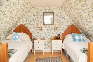 Ένα ή περισσότερα κρεβάτια σε δωμάτιο στο Balnagown Estates