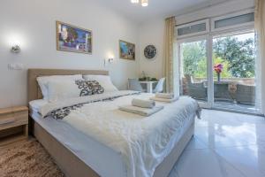 Ένα ή περισσότερα κρεβάτια σε δωμάτιο στο Villa Lucia