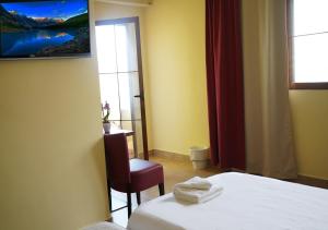 Posteľ alebo postele v izbe v ubytovaní Das Hostal