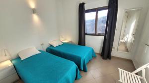 Ένα ή περισσότερα κρεβάτια σε δωμάτιο στο Apt con piscina La Laja, La Restinga (El Hierro)