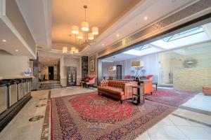 a living room with a couch and a table at Premier Hotel Cape Town in Cape Town