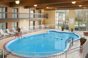 a large pool in the middle of a large building at Days Inn by Wyndham Rock Falls in Rock Falls