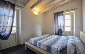 a bedroom with a bed and a window at Lovely Home In Santa Maria Albiano in Santa Maria Albiano