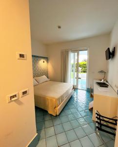 Postel nebo postele na pokoji v ubytování Ganimede Hotel + 37 fotografií