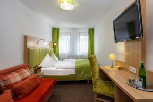 Llit o llits en una habitació de Spreewald Pension Tannenwinkel