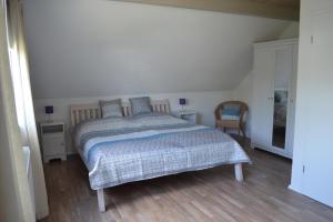 Cama o camas de una habitación en HM - Ferienhaus 3 Deluxe Krombachtalsperre Westerwald exklusive verbrauchte NK