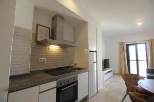 A kitchen or kitchenette at Del Parque Flats Parras Suite