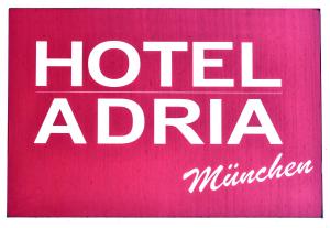 a red and white sign with a picture of a person at Hotel ADRIA München in Munich