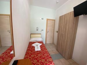 Posteľ alebo postele v izbe v ubytovaní Hotel Nanni Garnì