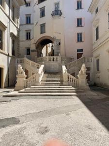 a building with stairs in front of a building at appartamento di via macello vecchio in Spoleto
