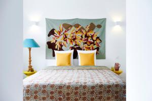 En eller flere senge i et værelse på Vila Branca Guesthouse - Palacete