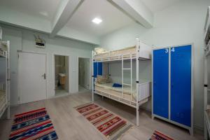 A bed or beds in a room at XALİLA HOSTEL & CAFE LADİES ROOM